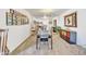 Bright dining area with glass table and chairs, view into living room at 7910 E Camelback Rd # 312, Scottsdale, AZ 85251