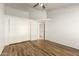 Bright bedroom with wood-look floors and a double door closet at 7915 W Wethersfield Rd, Peoria, AZ 85381