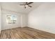 Bright bedroom with wood flooring and ceiling fan at 7915 W Wethersfield Rd, Peoria, AZ 85381