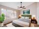 Main bedroom with a plush bed and large window, offering abundant natural light at 8039 N 48Th Ave, Glendale, AZ 85302