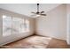 Main bedroom with a plush bed and large window, offering abundant natural light at 8039 N 48Th Ave, Glendale, AZ 85302