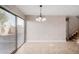 Empty dining room with sliding glass doors and tile floors at 8039 N 48Th Ave, Glendale, AZ 85302