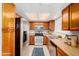 Bright kitchen featuring stainless steel appliances and light wood cabinets at 8039 N 48Th Ave, Glendale, AZ 85302