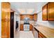 Bright kitchen featuring stainless steel appliances and light wood cabinets at 8039 N 48Th Ave, Glendale, AZ 85302