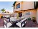 Outdoor patio with a concrete table and chairs, ideal for relaxing at 8039 N 48Th Ave, Glendale, AZ 85302