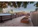 Wide angle of backyard with string lights, benches and garden beds, and lots of room to enjoy the outdoors at 811 W Whitton Ave, Phoenix, AZ 85013