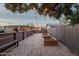 Backyard with string lights, garden beds and benches, perfect for outdoor gatherings and gardening at 811 W Whitton Ave, Phoenix, AZ 85013