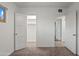 Bedroom featuring neutral carpet, white walls, and doorways to closet and other rooms at 811 W Whitton Ave, Phoenix, AZ 85013