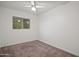 Bedroom with neutral carpet, window with blinds, and ceiling fan at 811 W Whitton Ave, Phoenix, AZ 85013