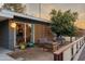 Cozy front patio featuring modern patio set and a lush orange tree at 811 W Whitton Ave, Phoenix, AZ 85013