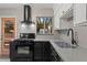 Updated kitchen featuring stainless steel appliances, white cabinets, and contrasting countertops at 811 W Whitton Ave, Phoenix, AZ 85013