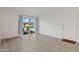 Bright living room with large window, neutral walls, and tile flooring at 811 W Whitton Ave, Phoenix, AZ 85013