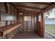 Inside a wood framed shed featuring a workbench, pegboard, natural light, and a glimpse of the backyard at 811 W Whitton Ave, Phoenix, AZ 85013