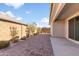 Private backyard with covered patio and brick pavers at 8908 W Bethany Heights Dr, Glendale, AZ 85305