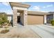 Single-story home with stone accents and two-car garage at 8908 W Bethany Heights Dr, Glendale, AZ 85305