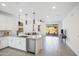 Modern kitchen island with white cabinets and stainless steel appliances at 8908 W Bethany Heights Dr, Glendale, AZ 85305