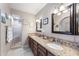 Spacious bathroom with double sinks, granite countertops, and a walk-in shower at 9041 E Ludlow Dr, Scottsdale, AZ 85260