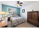 Bright bedroom with a ceiling fan and large window at 9041 E Ludlow Dr, Scottsdale, AZ 85260