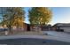 Charming single-story home with mature trees and a spacious driveway at 9041 E Ludlow Dr, Scottsdale, AZ 85260