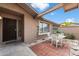 Private front patio with a table and chairs, perfect for relaxing outdoors at 9041 E Ludlow Dr, Scottsdale, AZ 85260