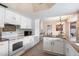 Spacious kitchen with granite countertops and white cabinetry at 9041 E Ludlow Dr, Scottsdale, AZ 85260