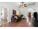 Bright living room featuring hardwood floors and a view into the kitchen at 9041 E Ludlow Dr, Scottsdale, AZ 85260