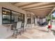 Covered patio with seating area, overlooking the pool at 9041 E Ludlow Dr, Scottsdale, AZ 85260