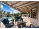 Spacious patio with wicker furniture and a view of the pool at 9041 E Ludlow Dr, Scottsdale, AZ 85260