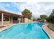 Inviting kidney shaped pool with flagstone decking at 9041 E Ludlow Dr, Scottsdale, AZ 85260