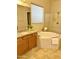 Bathroom boasts a soaking tub, double vanity, and walk-in shower at 9144 W Sands Dr, Peoria, AZ 85383