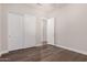 This bedroom features luxury vinyl plank flooring and a closet with sliding doors at 9144 W Sands Dr, Peoria, AZ 85383