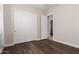 This bedroom features luxury vinyl plank flooring and a closet with sliding doors at 9144 W Sands Dr, Peoria, AZ 85383