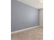 Neutral bedroom with gray accent wall, tile flooring, ceiling fan, and base molding at 9144 W Sands Dr, Peoria, AZ 85383