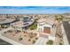 Attractive house featuring desert landscaping and solar panels, set against a neighborhood backdrop at 9144 W Sands Dr, Peoria, AZ 85383