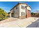 Two-story stucco home with attached garage, desert landscaping, and a covered front porch at 9144 W Sands Dr, Peoria, AZ 85383