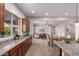 Open kitchen view flowing into dining and living area with natural light at 9144 W Sands Dr, Peoria, AZ 85383