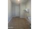 Laundry room with tile floor and built-in shelving at 9144 W Sands Dr, Peoria, AZ 85383