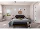 Comfortable carpeted main bedroom showcasing natural light and modern design at 9144 W Sands Dr, Peoria, AZ 85383