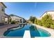 Sparkling backyard pool with diving board, offering a refreshing oasis for relaxation and fun at 9144 W Sands Dr, Peoria, AZ 85383