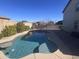 Inviting swimming pool with surrounding patio at 9144 W Sands Dr, Peoria, AZ 85383