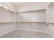 Spacious carpeted walk-in closet with ample shelving and storage at 9144 W Sands Dr, Peoria, AZ 85383