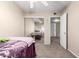 Bright bedroom with mirrored closet doors and neutral carpeting at 944 S Valencia -- # 3, Mesa, AZ 85202