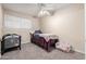 Small bedroom with a twin bed and ceiling fan at 944 S Valencia -- # 3, Mesa, AZ 85202