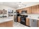 Kitchen with stainless steel appliances and wood cabinets at 944 S Valencia -- # 3, Mesa, AZ 85202