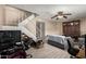 Living room with gray couch, stairs, and wood cabinet at 944 S Valencia -- # 3, Mesa, AZ 85202