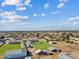 Aerial view showcasing a house, pool, and barn with stables at 9449 S 156Th Pl, Gilbert, AZ 85234