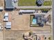 Aerial view showing property, pool, and stables at 9449 S 156Th Pl, Gilbert, AZ 85234