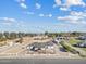 Aerial view of a large property with a house, pool, and equestrian facilities at 9449 S 156Th Pl, Gilbert, AZ 85234