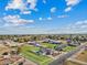 Aerial view of a large property with a house, pool, and equestrian facilities at 9449 S 156Th Pl, Gilbert, AZ 85234