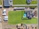 Aerial view showcasing a home, pool, and expansive grounds with equestrian facilities at 9449 S 156Th Pl, Gilbert, AZ 85234